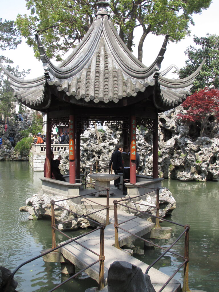 Mid-pond pavilion with Taihu rock in the background, at Lion's Grove (Shi Zi Lin).
